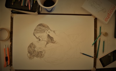 An artist sketching a romantic couple with soft pencil strokes.
