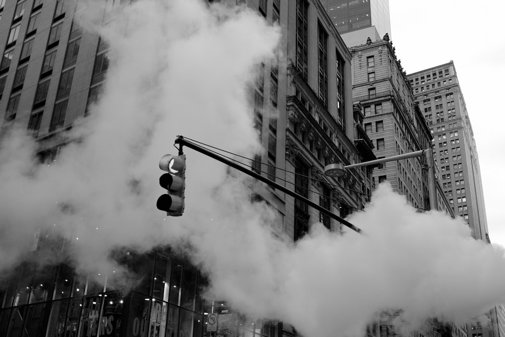 grayscale traffic light near building