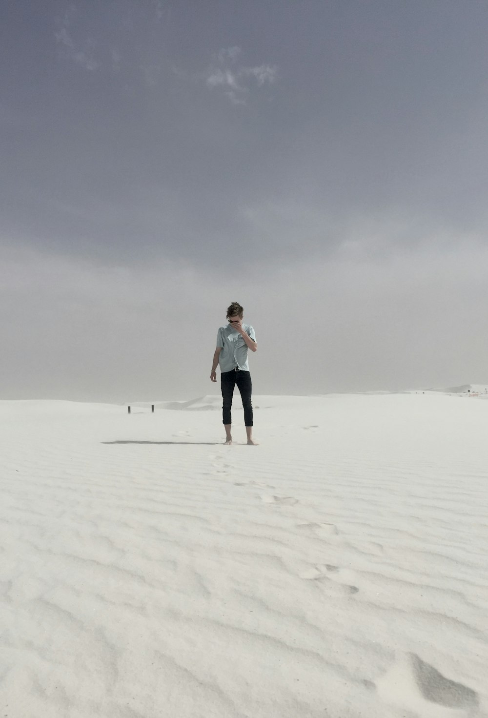 man walking on desert during daytime