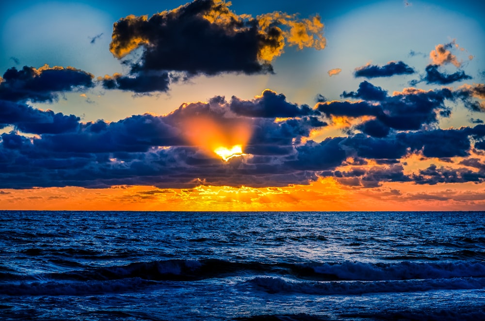 body of water during sunset