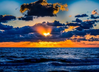 body of water during sunset