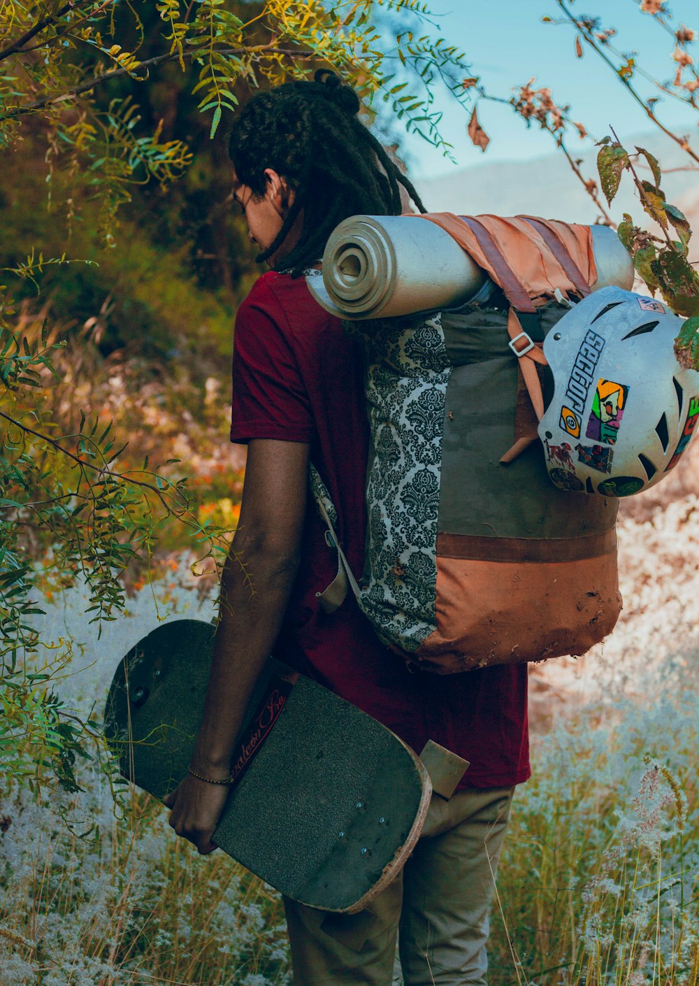 man holding skateboard