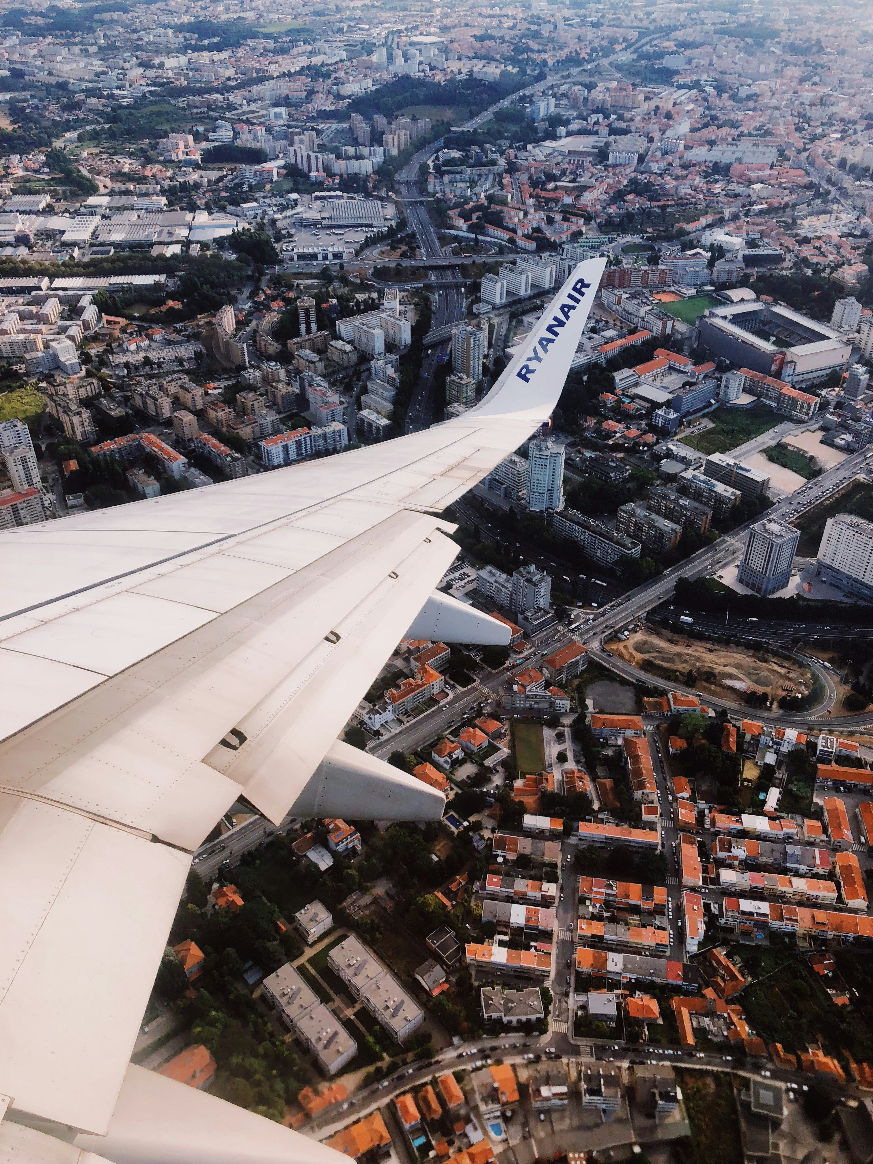 ryanair plane wing over european city