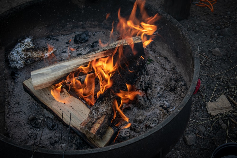 lit firewoods in firepit