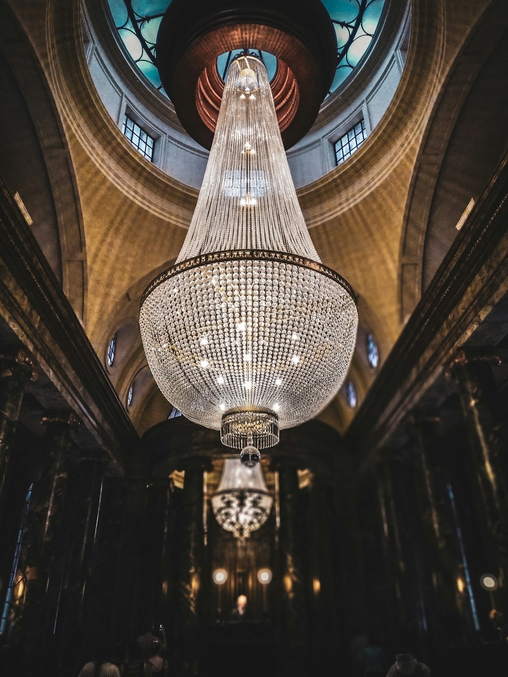 silver crystal chandelier placed on ceiling