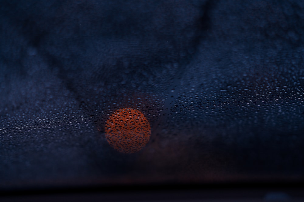 a close up of a window with rain drops on it