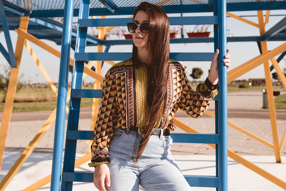 portrait photography of woman leaning on stair