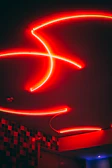 Wall art featuring bold red and black gaming designs with neon accents.