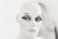 A mannequin head with stylized makeup, featuring dramatic eyeliner and bold eyebrows, set against a blurred background.