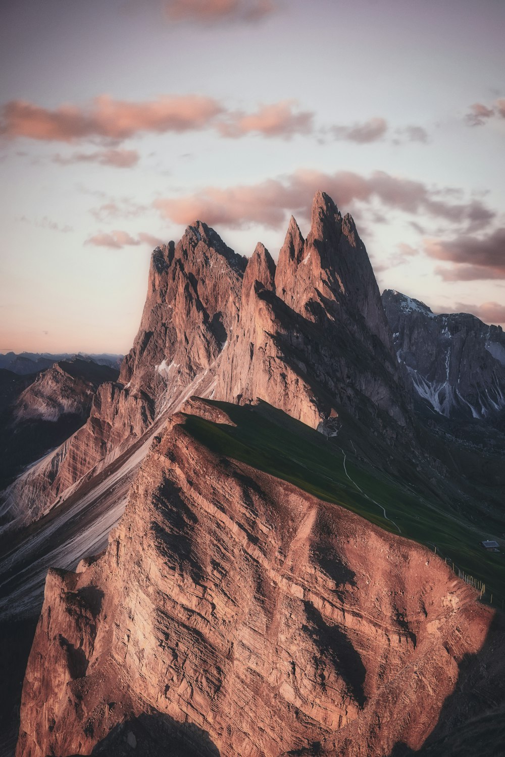 brown mountain under gray sky