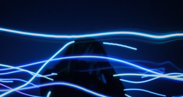 pre-lit blue string light through a person to show  headaches pass by