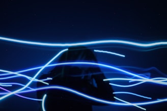 pre-lit blue string light through a person to show  headaches pass by