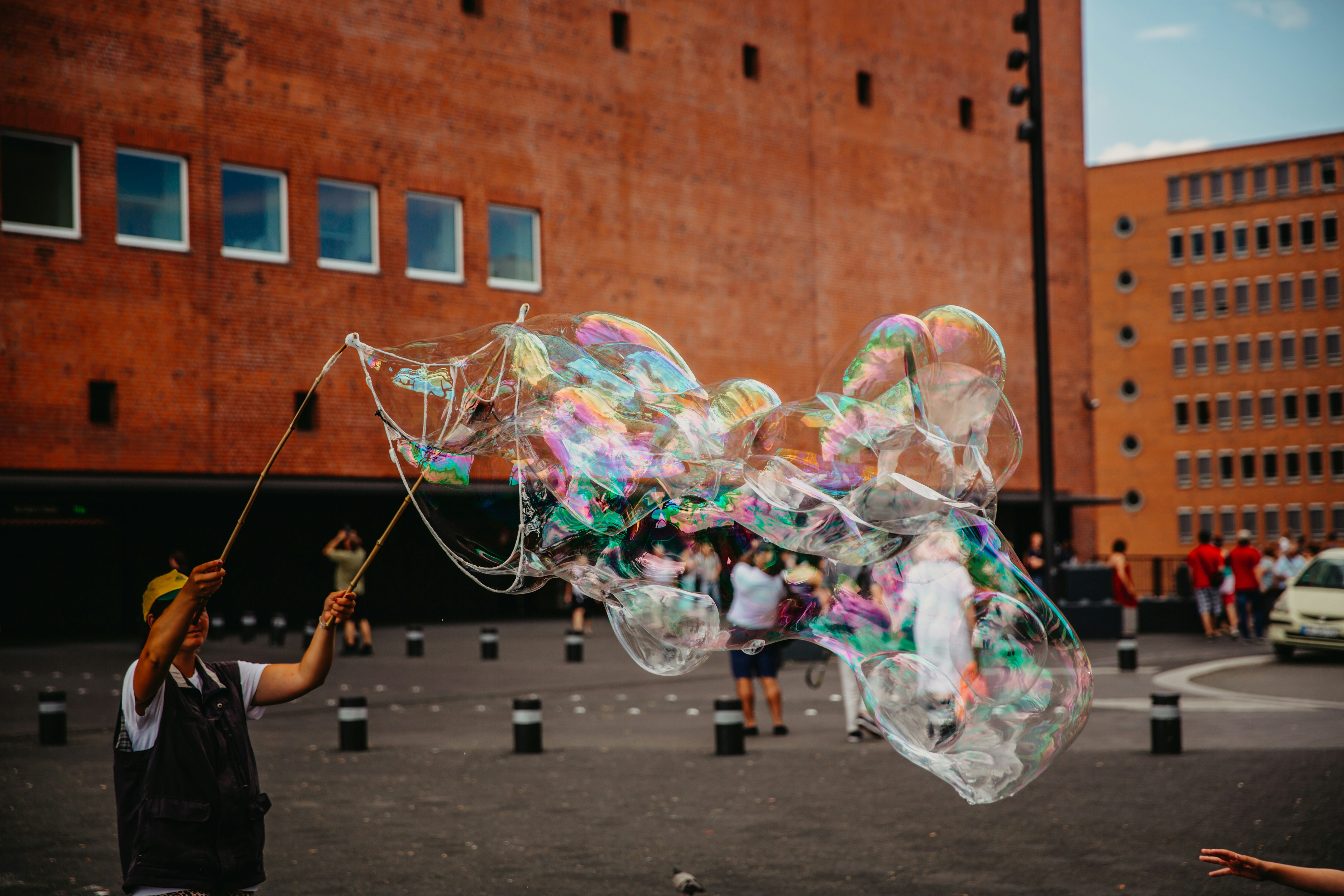 man doing bubble stunts at daytime