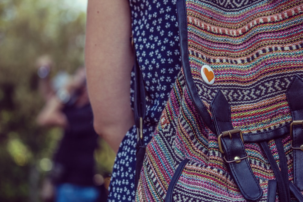 person wearing knapsack outdoor during daytime