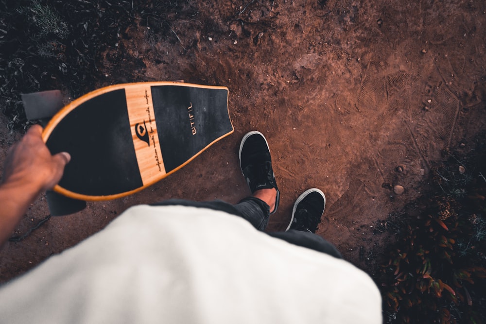 person holding cruiser board