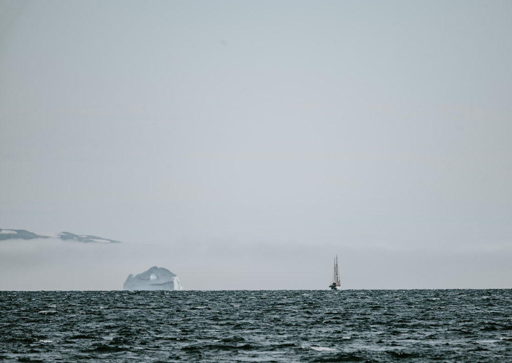 sailing ship towards island