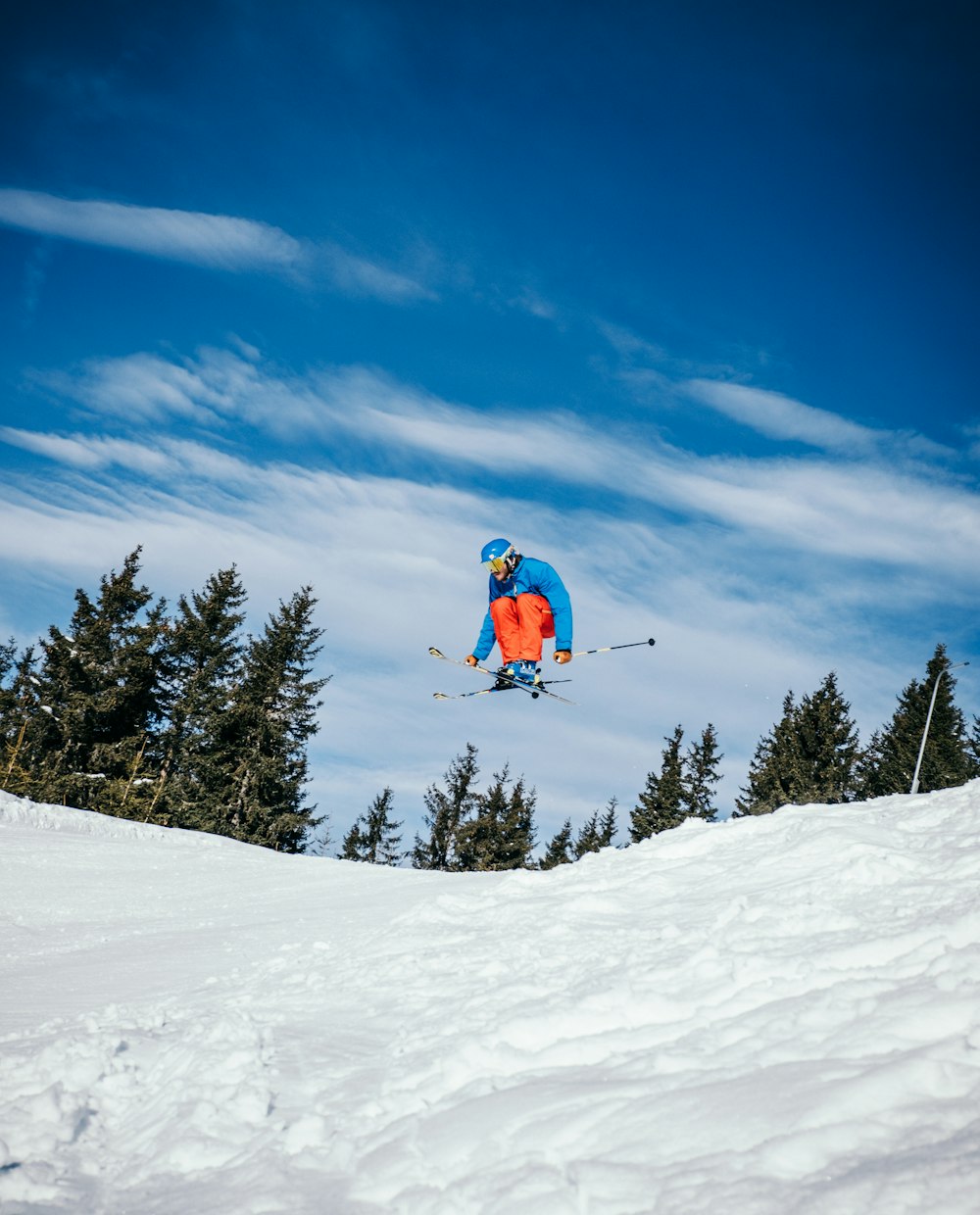 person skiing on field covered of snow at daytime