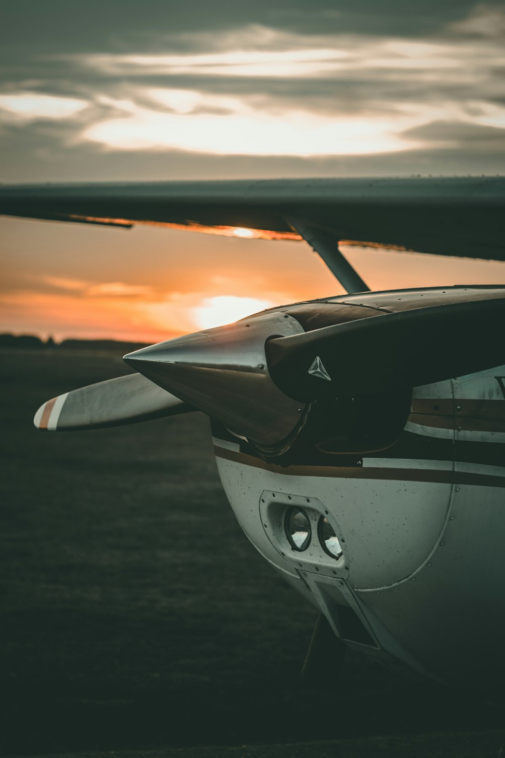 close-up photography of brown and white plane during sunrise