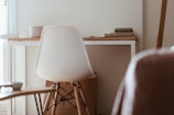 A bright workspace with a minimalist wooden desk and chair.