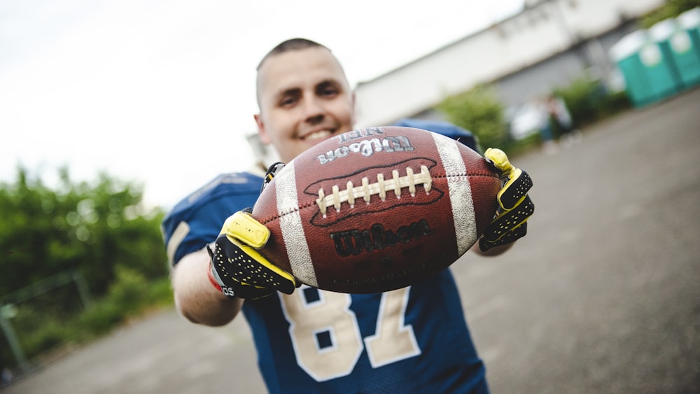 man holding football