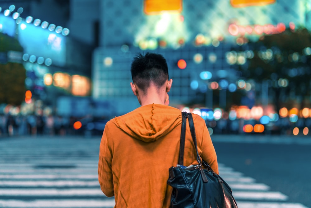 man walking on pedestrian lane