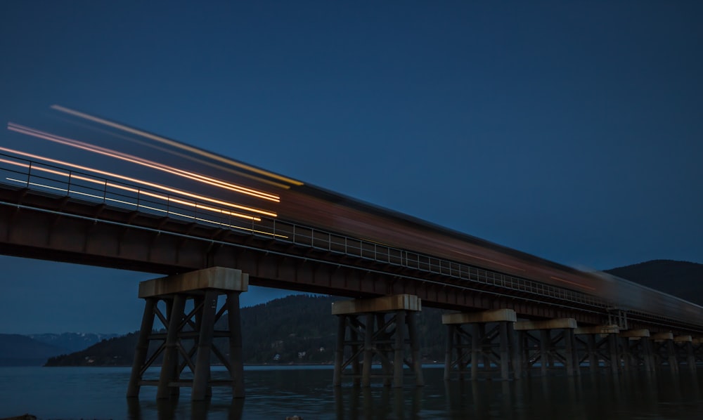 timelapse photo of train at nighttime