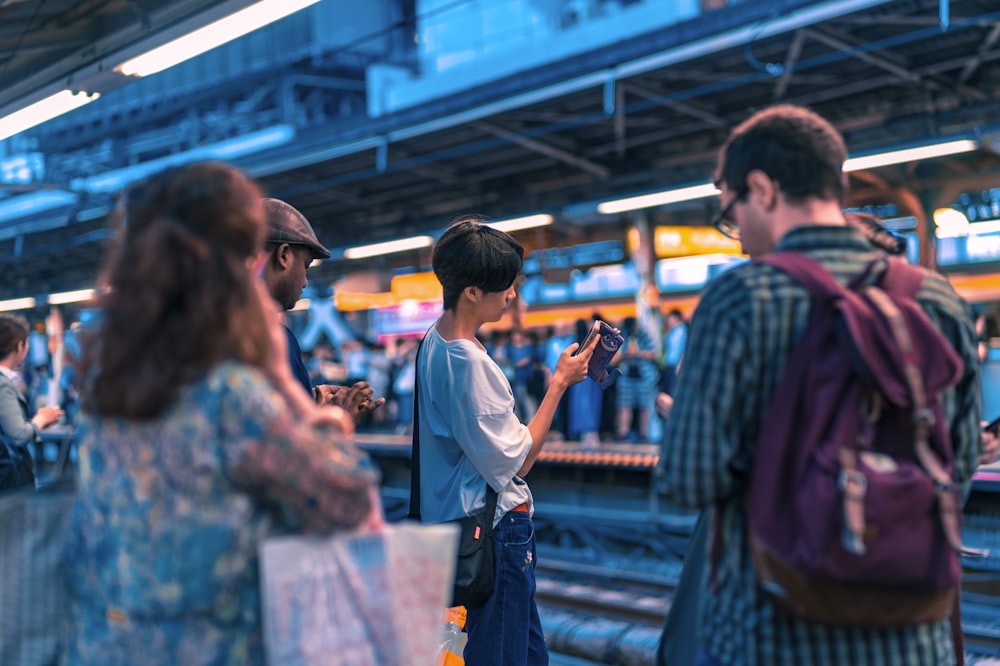 people waiting train at daytime