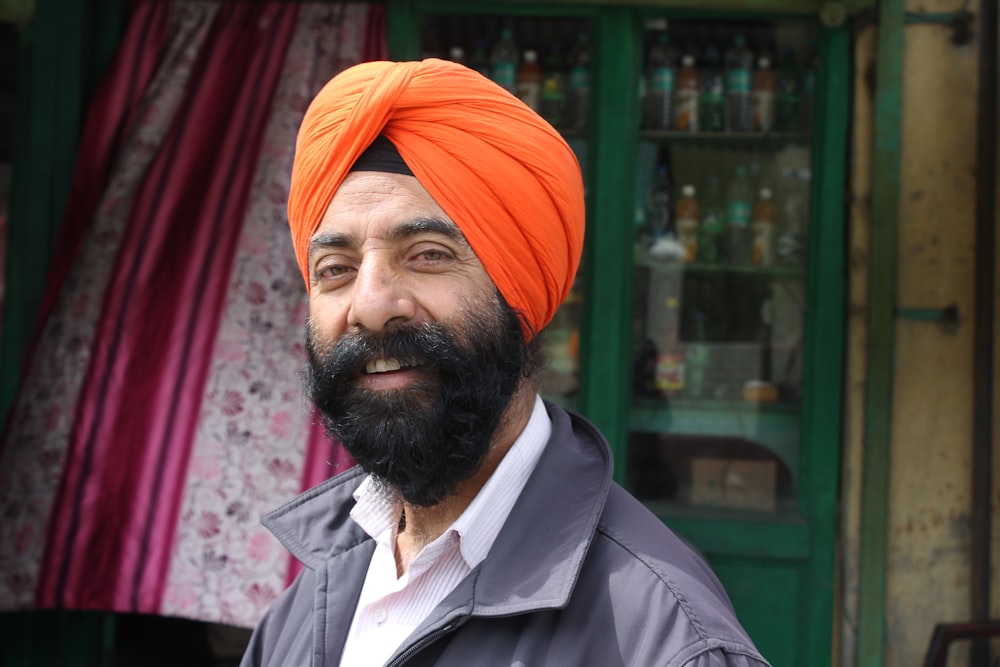 man wearing orange turban