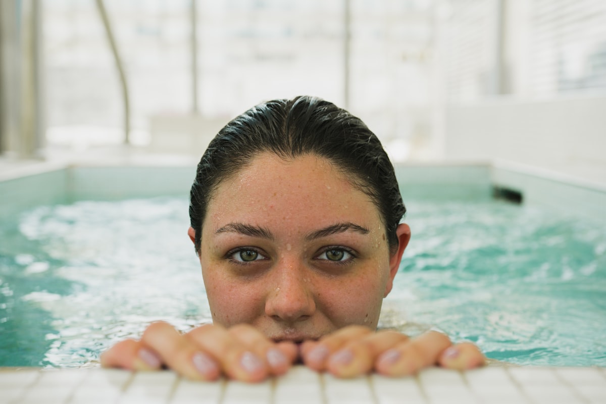 Selective focus photo of woman in swimming pool