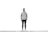 A person stands against a plain white wall wearing a hoodie, skinny jeans, and sneakers. The setting is minimalistic, with the individual centered in the composition.