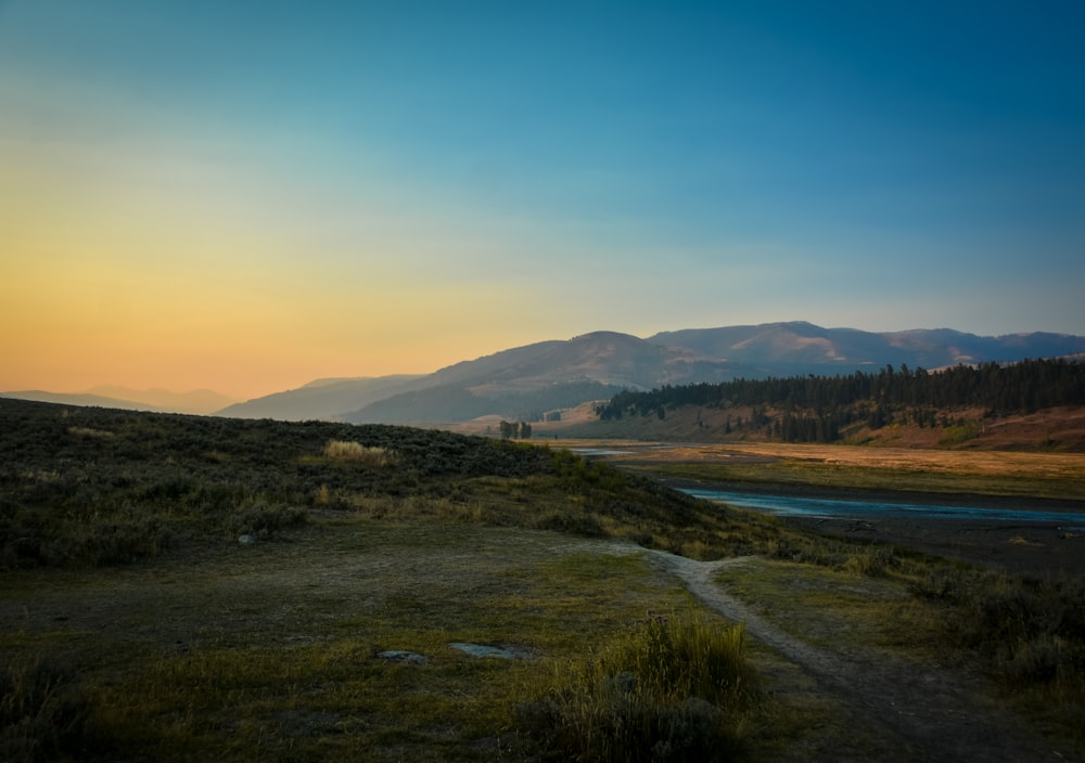 landscape photography of river and mountain