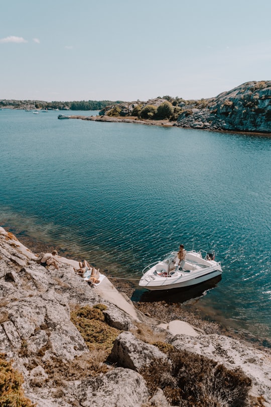 white boat on body of water in Grebbestad Sweden