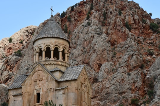 beige chapel near mountain in Noravank Armenia