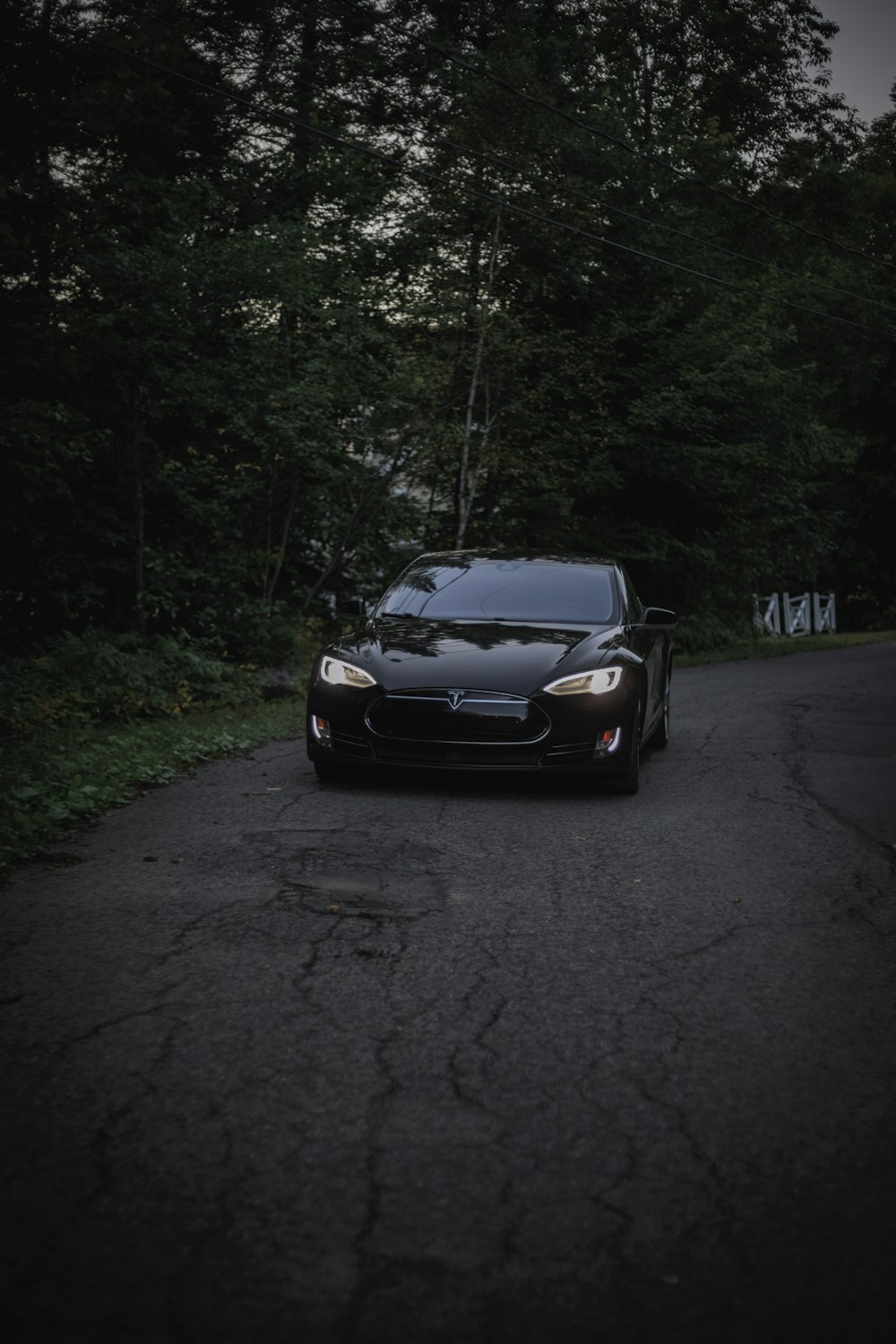 black Tesla Model S at nighttime