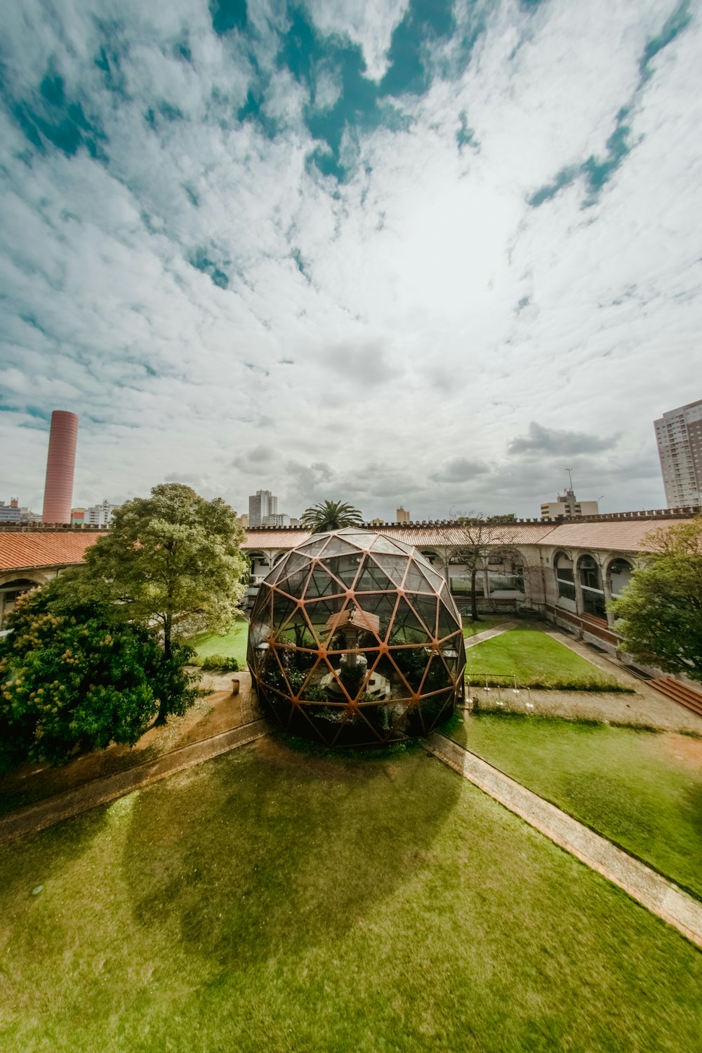 gray glass dome surrounded with plant