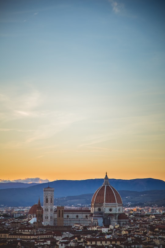 brown temple under yellow sky during daytime in Florence Italy