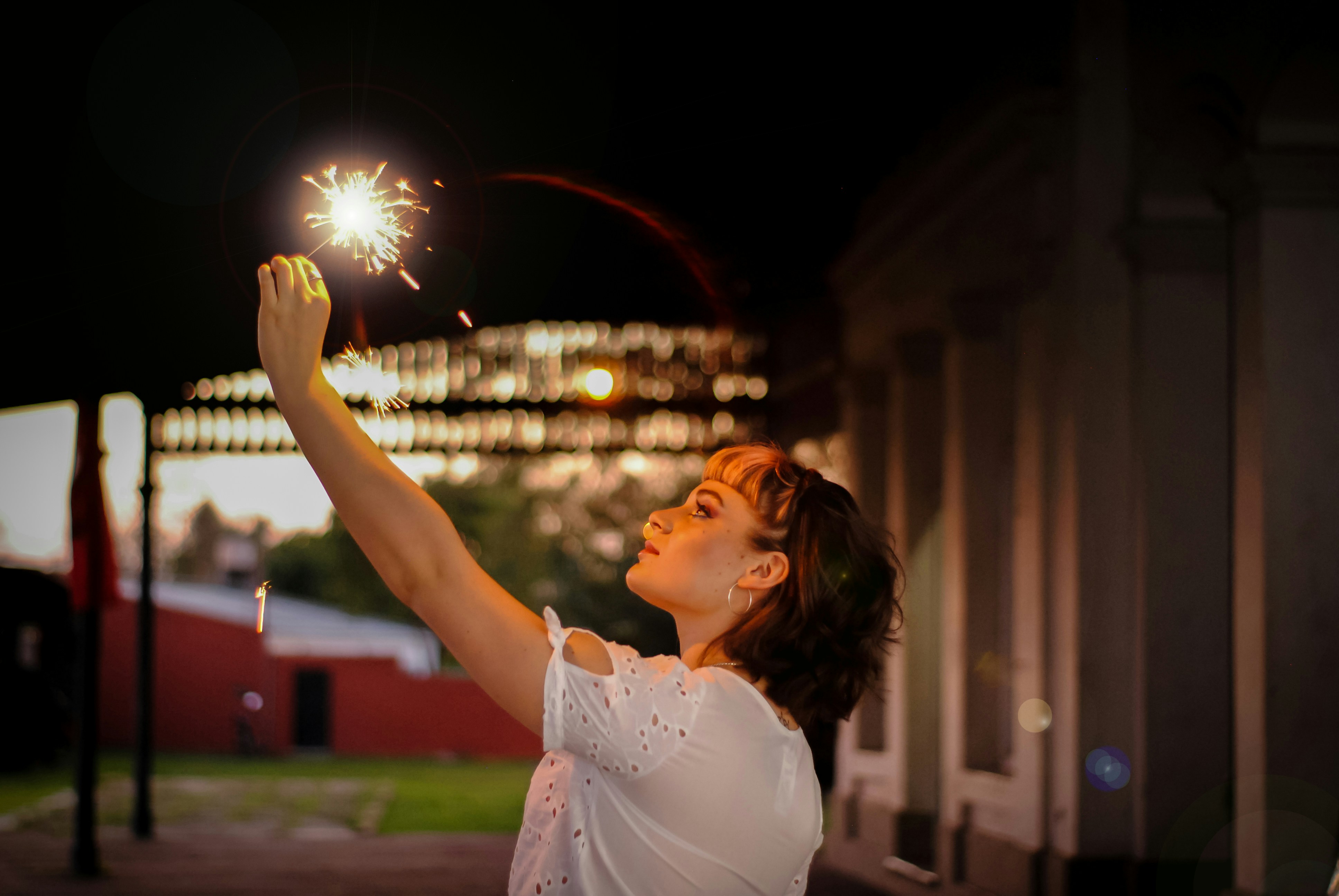 woman holding sparkler