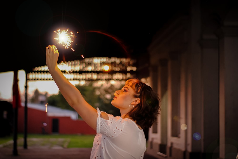 woman holding sparkler