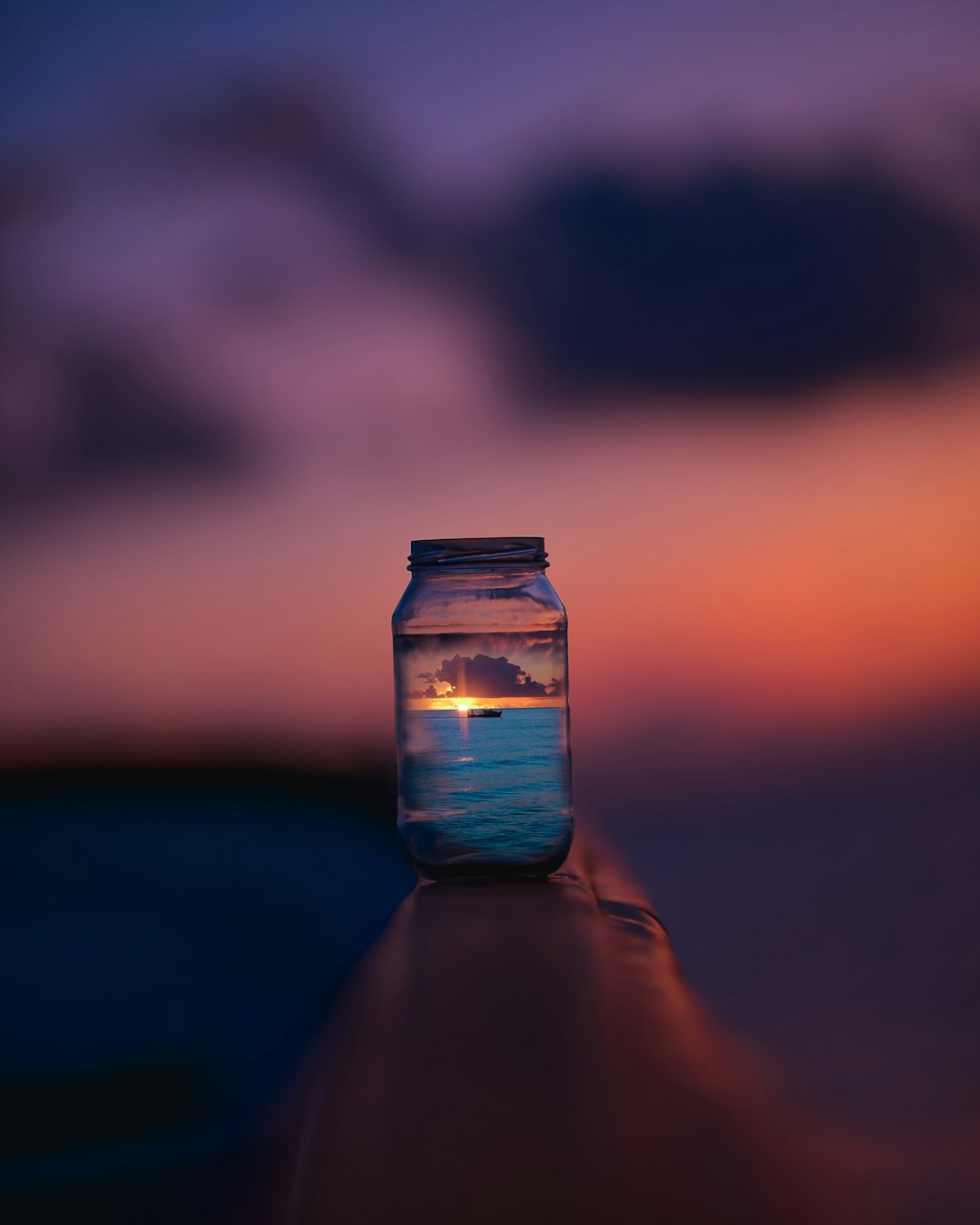 view of sunset on glass jar