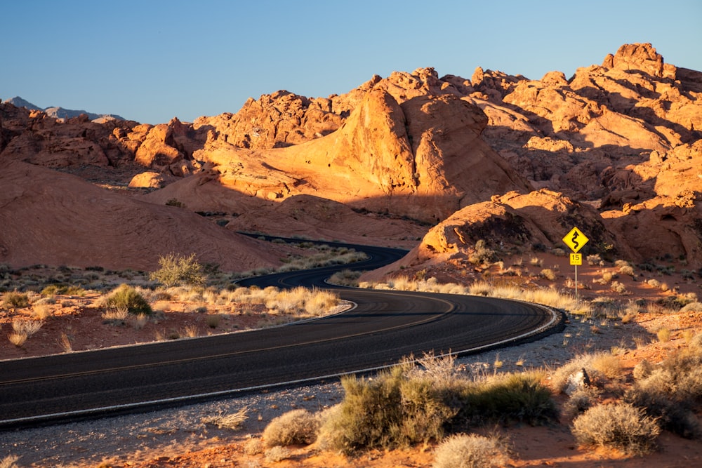 landscape photography of whining road near mountains