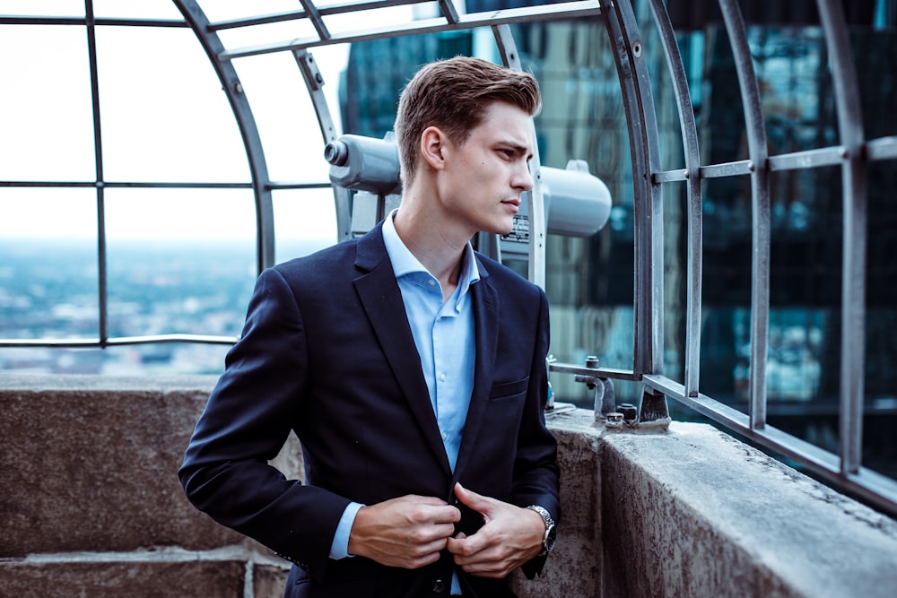 man wearing black suit jacket