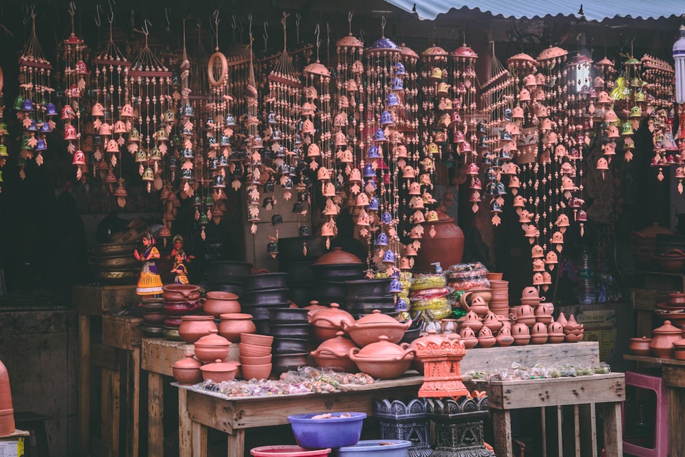 brown and black pots and hanging decors in store