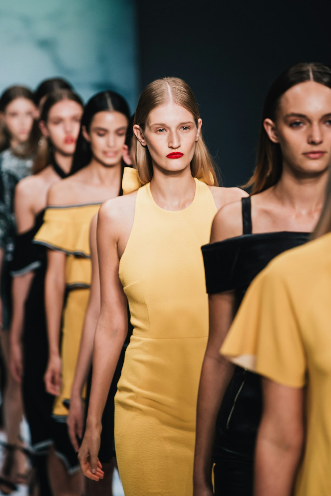 woman wearing yellow sleeveless dress