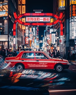 red car on city wallpaper