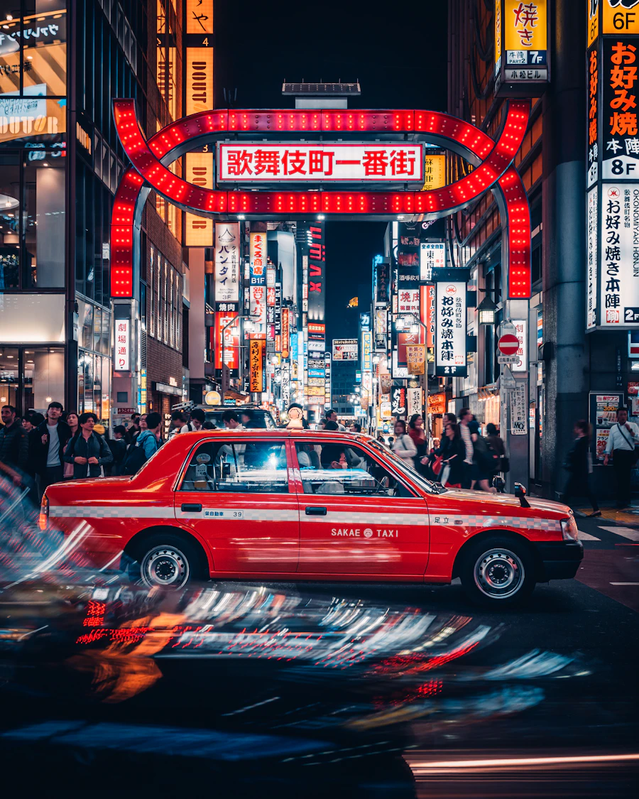 Red car on a city street