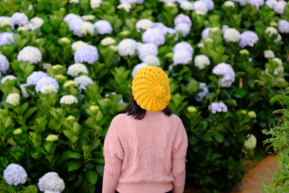 person standing near flowers