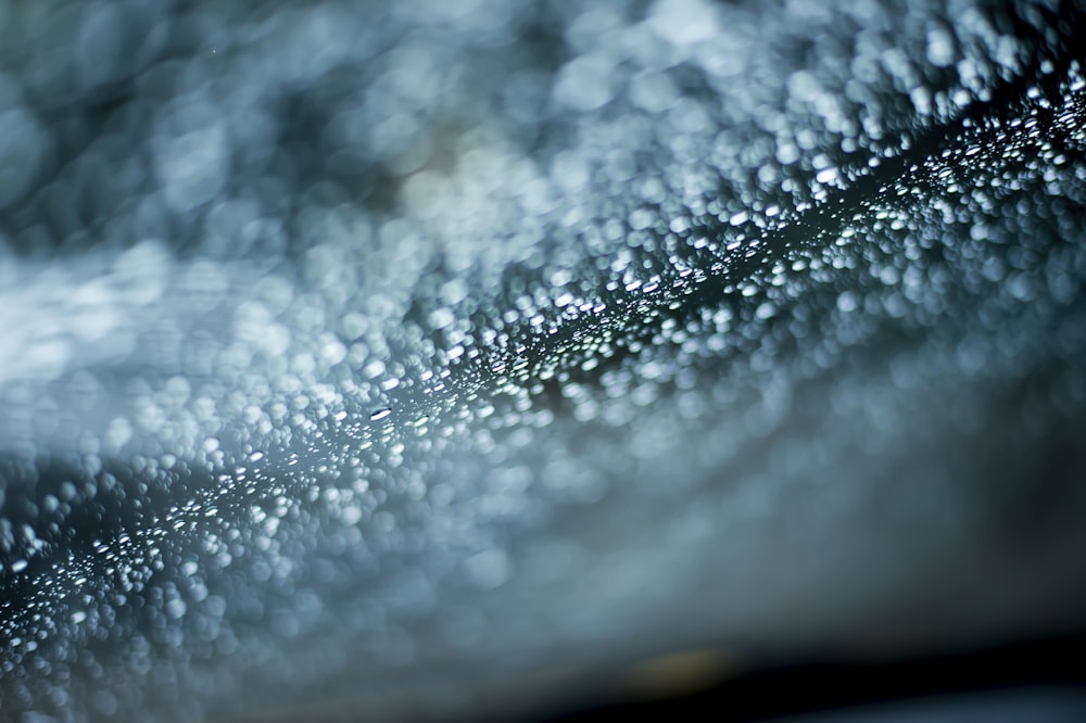 a close up of water droplets on a surface