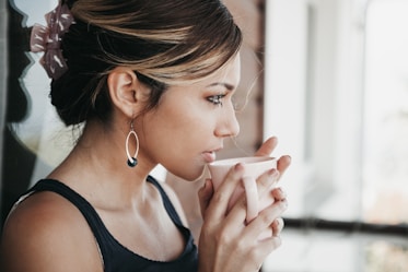 woman drinking cup