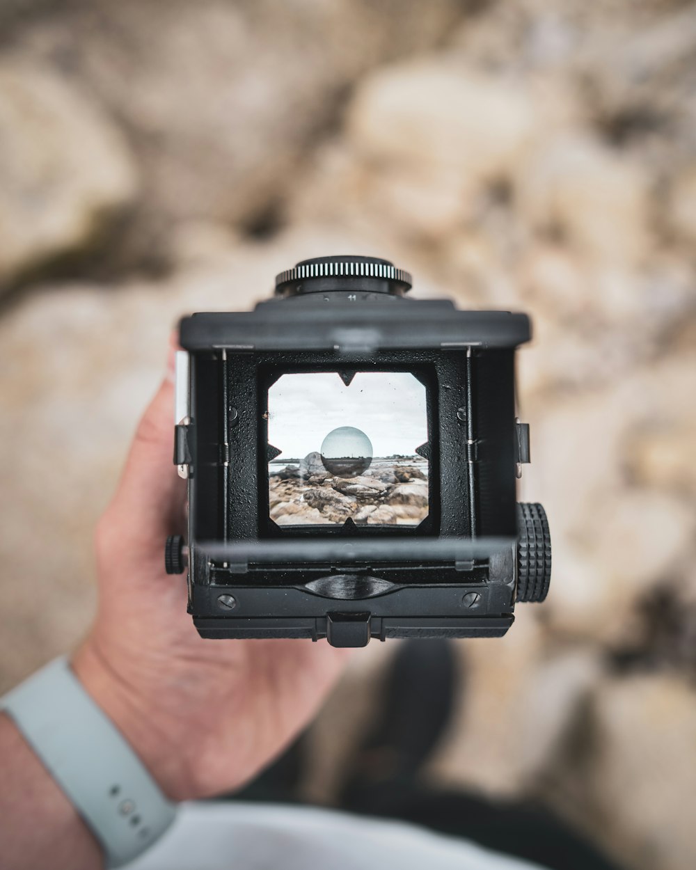 person holding black camera