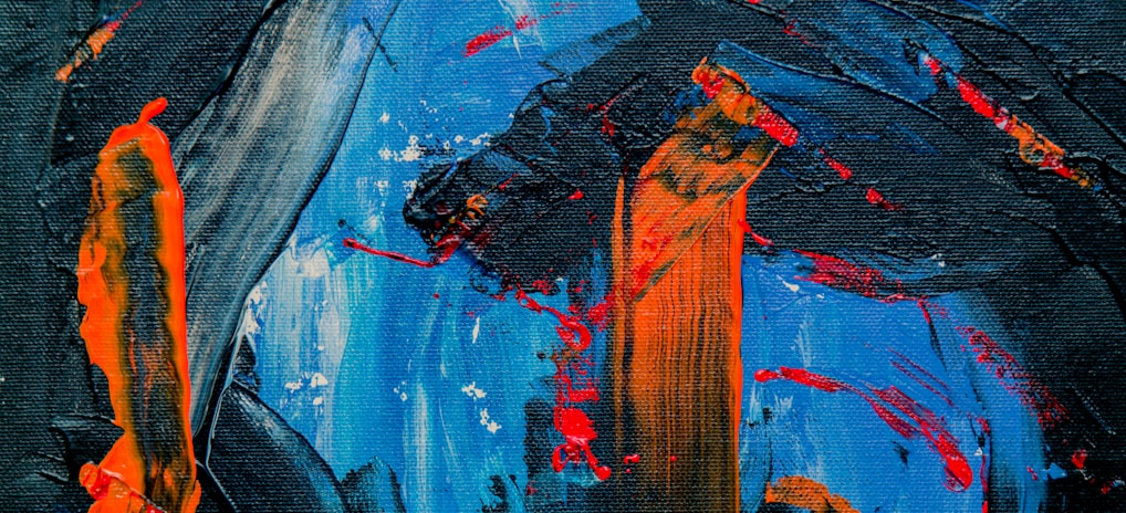 blue, black, and orange abstract painting